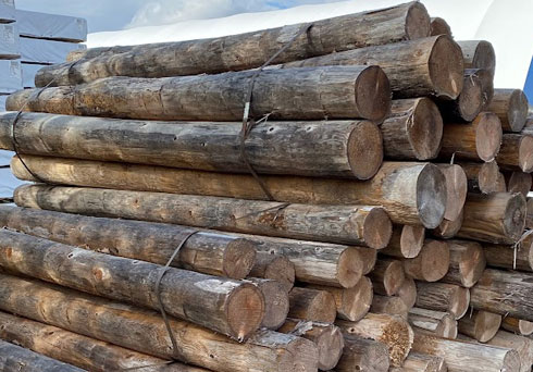 farm fence logs in pile
