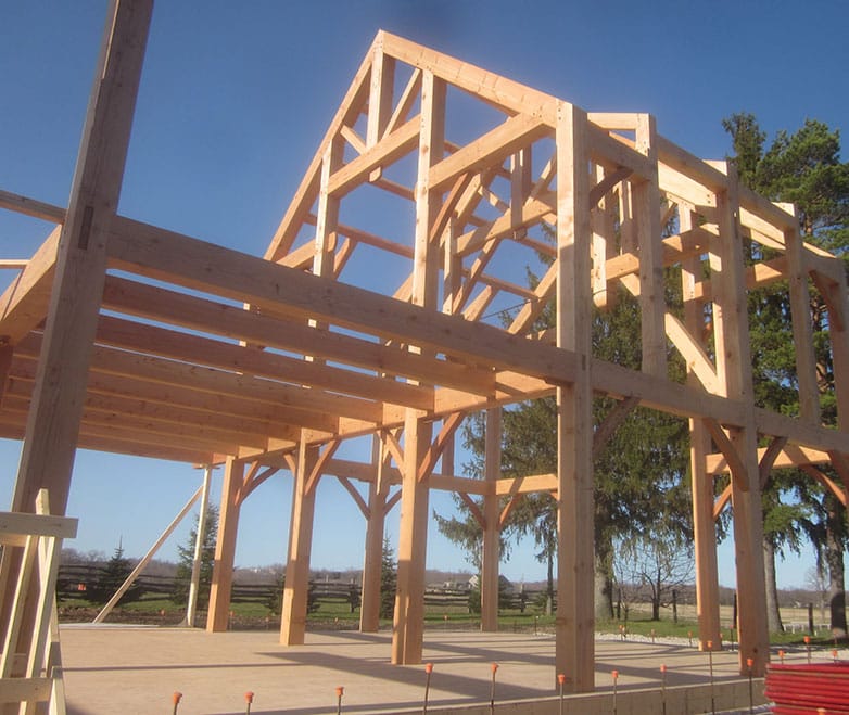 large timber frames being constructed